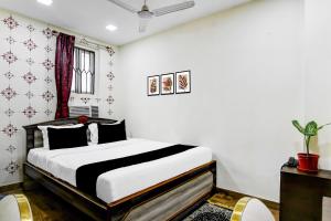 En eller flere senge i et værelse på Hotel O SPRINGWOODS HOSPITALITY