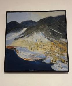 a painting hanging on a wall at Apartament Booking Ultracentral in Bistriţa