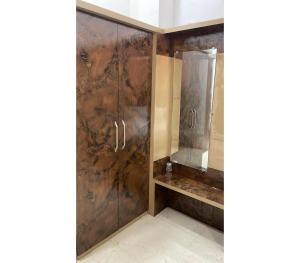 a bathroom with a shower and a mirror at Hotel Shree Nikatan in Ara