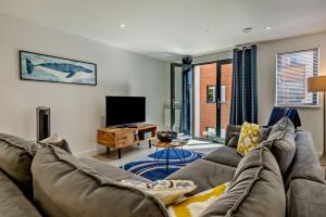 a living room with a couch and a tv at 2 Bed in Woolacombe oc-s29622 in Woolacombe