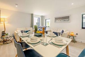 a dining room with a white table and chairs at 3 Bed in Woolacombe oc-s29462 in Woolacombe