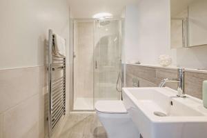 a bathroom with a toilet and a sink and a shower at 3 Bed in Woolacombe oc-s29462 in Woolacombe +14 photos