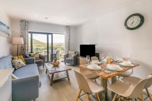 a dining room and living room with a table and chairs at 3 Bed in Woolacombe oc-t29466 in Woolacombe