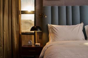 מיטה או מיטות בחדר ב-IRIS Inn Narjis Riyadh