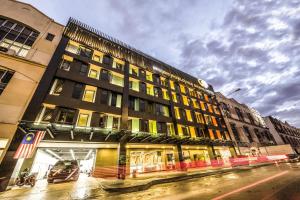 a large building on a city street with at Worldview Grand Hotel in Kuala Lumpur