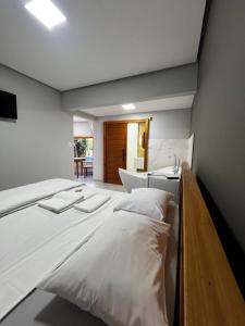 Giường trong phòng chung tại Pousada do Rui