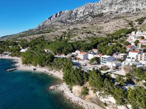 an aerial view of a resort next to the ocean at Apartments Giran in Lokva Rogoznica
