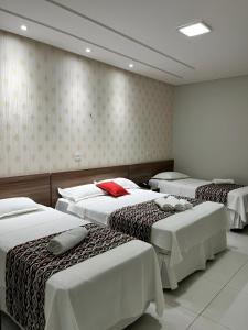 Giường trong phòng chung tại Pousada Lagoa Seca