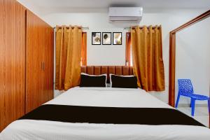 Giường trong phòng chung tại Varahi Stay Inn