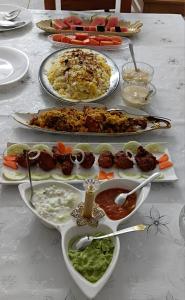 a table with several plates of food on it at UPPU HOMESTAY in Mulappilangād +14 photos