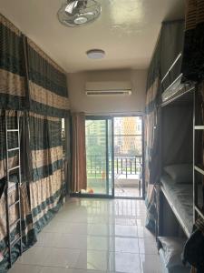a room with a hallway with a door to a balcony at OST Homes Rolla Park in Sharjah