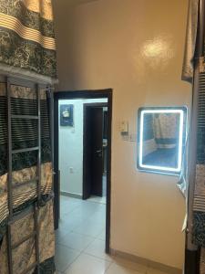 a room with a door and a room with bunk beds at OST Homes Rolla Park in Sharjah
