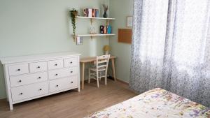 En eller flere senge i et værelse på Appartamento Pesaro - Casa Nana