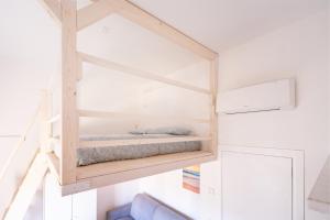 a bedroom with a bed in a room at Conca d'Oro Apartments, camera 1 e 2 in Nago-Torbole