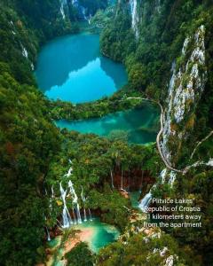 an aerial view of a waterfall in a mountain valley at Apartman EM-Bajkeraj in Bihać +22 photos
