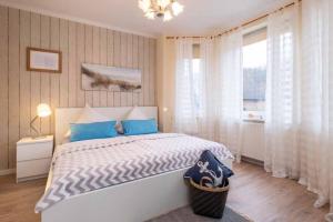 En eller flere senge i et værelse på Ferienhaus Fehlingstr 31