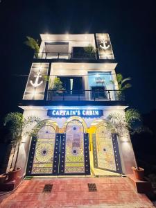 a building with a sign that reads calaris castle at Captains cabin in Tikri Kalān