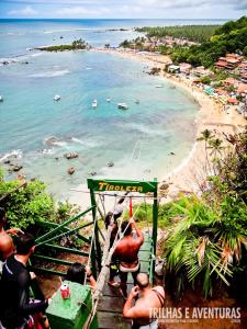 a group of people on the stairs to the beach at Encantos do Morro in Cayru