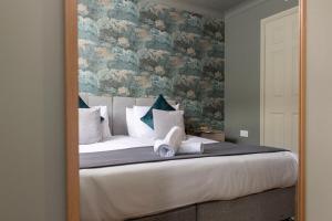 Postel nebo postele na pokoji v ubytování Bridges Retreat, Newcastle