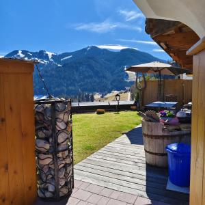 a wooden deck with a view of a mountain at Ferienwohnung Pusteblume4 in Oberau