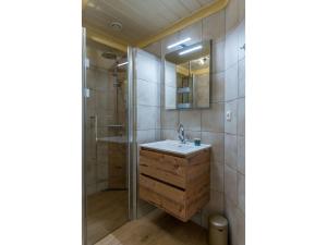 a bathroom with a sink and a shower at Lovely Holiday Home in Texel near Sea in Oost +22 photos