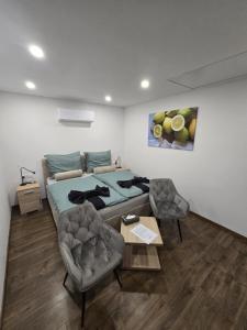 En eller flere senge i et værelse på CitrusLiget Vendégház