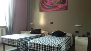 Postel nebo postele na pokoji v ubytování La Quercia Hotel con Ristorante