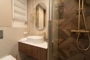 Et badeværelse på Laguna Beskidów Resort - Apartament Pudrowy