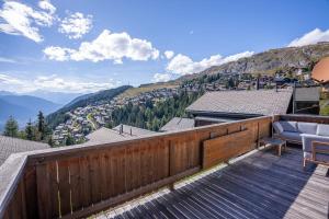 a balcony with a view of the mountains at Chalet Mazze in Bettmeralp