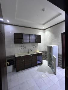 Køkken eller tekøkken på تليد للشقق الفندقية