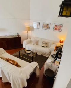 En eller flere senge i et værelse på Santuário SOS Animal