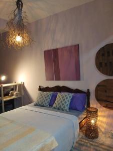 En eller flere senge i et værelse på Falésias de Carapibus