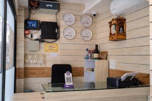 a room with clocks on a wall at Relax Hotel Kurla in Mumbai