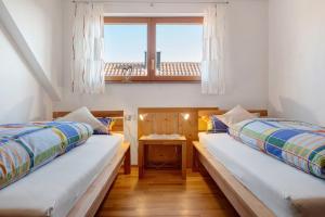 Giường trong phòng chung tại Haus am Ettenberg