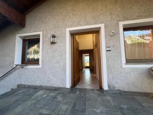 a house with a door leading to a hallway at Dolomiten View - South Tyrol in Villandro