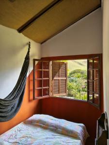 Postel nebo postele na pokoji v ubytování Casa Maia Sana Hostel