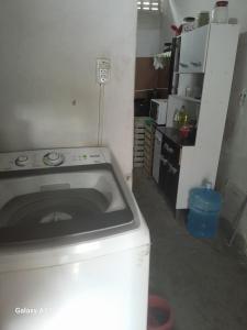 a kitchen with a stove and a counter top at Casa para alugar para o Carnaval in Recife