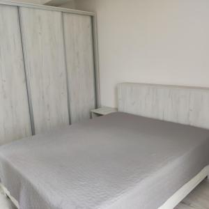 Giường trong phòng chung tại Class Apartments