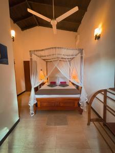 En eller flere senge i et værelse på Brown Birds Villa