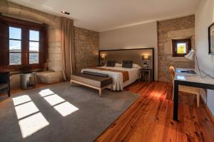 Postel nebo postele na pokoji v ubytování Hospedería Palacio de Allepuz