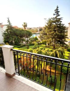 a balcony with a view of a park at Condominio Ariazzurra S. Bart. in San Bartolomeo al Mare