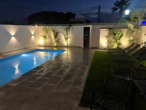 a swimming pool in a backyard at night at Villa Palma Cabo Roig 31a in Orihuela Costa