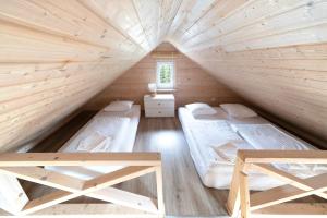 En eller flere senge i et værelse på Słoneczny Zakątek + 39 billeder