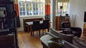 a living room with a couch and a table at St Davids House in Cranbrook