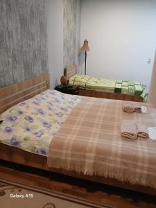 En eller flere senge i et værelse på Eni Rooms