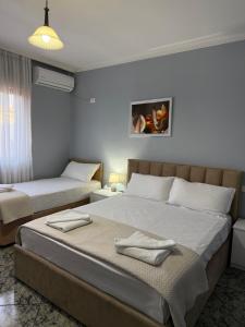 En eller flere senge i et værelse på Villa CTT