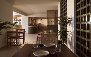 a dining room with a table and chairs at Gerakas Belvedere Hotel & Spa in Vasilikos