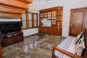 Et tv og/eller underholdning på Alite Posh 4 BHK Villa in Thrissur Town