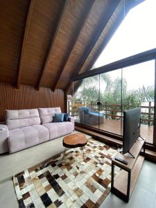 Et opholdsområde på Refúgio na Rocha - Chalé