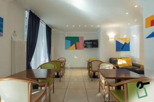 TV a/nebo společenská místnost v ubytování Hotiday La Spezia Centrale